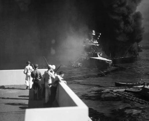 WORLD WAR II: PEARL HARBOR. The USS California lists slightly as it settles in the mud near the shore at the U.S. naval base at Pearl Harbor, Hawaii, after being hit by bombs and torpedoes during the Japanese attack on 7 December 1941.  Copyright: xGRANGERx xGRANGERx 0100311