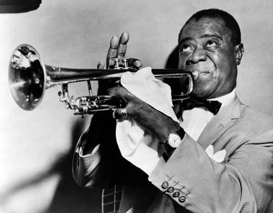 LOUIS ARMSTRONG (1900-1971). American jazz musician. Photographed playing trumpet, 1953.  Copyright: xGRANGERx xGRANGERx 0108692