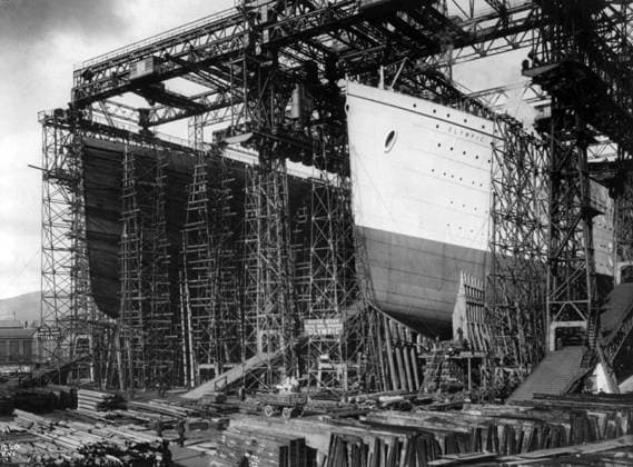 TITANIC: CONSTRUCTION, c1910. View of the Olympic (left) and Titanic under construction at the Harland & Wolff shipyards, Belfast, Ireland. Photographed c1910.  Copyright: xGRANGERx xGRANGERx 0109479