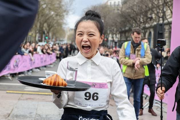 Bilder des Jahres 2024, News 03 März News Themen der Woche KW12 News Bilder des Tages La course des cafes - The Bistro race - Paris La course des cafes The Bistro race . the waitresses and waiter runner, dressed for the occasion according to the traditional codes of Parisian bistro service, service professionals of all levels, will set off on a 2 km course looping around the Paris City Hall, and crossing part of the Marais, the historic and commercial heart of the capital. on March 24, 2024 in Paris, France. Photo by Nasser Berzane ABACAPRESS.COM Paris France  Copyright: xBerzanexNasser ABACAx