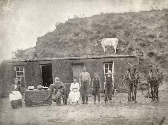 NEBRASKA: SETTLERS, c1886. A pioneer family photographed outside of their sod house at Sargent, Custer County, Nebraska. Photograph by Solomon D. Butcher, c1886.  Copyright: xGRANGERx xGRANGERx 0109902