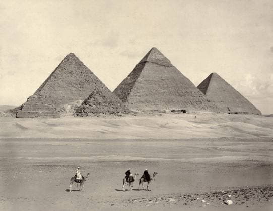 EGYPT: PYRAMIDS AT GIZA. The pyramids at Giza, Egypt, with three travelers in the foreground. Photograph, late 19th century.  Copyright: xGRANGERx xGRANGERx 0113309