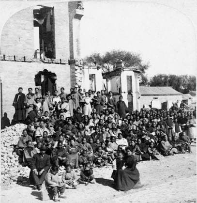 CHINA: BOXER REBELLION, c1901. A woman identified as Miss Smith sitting with the refugees she protected throughout the Siege of Beijing during the Boxer Rebellion, at the London Mission Schools, Beijing, China. Stereograph, c1901.  Copyright: xGRANGERx xGRANGERx 0116504