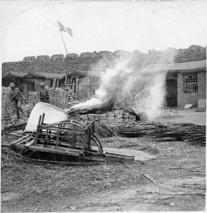 CHINA: BOXER REBELLION. Bodies of the Chinese being burned outside the wall at South Gate after the capture of the city, Tientsin, China. Stereograph, c1901.  Copyright: xGRANGERx xGRANGERx 0116728