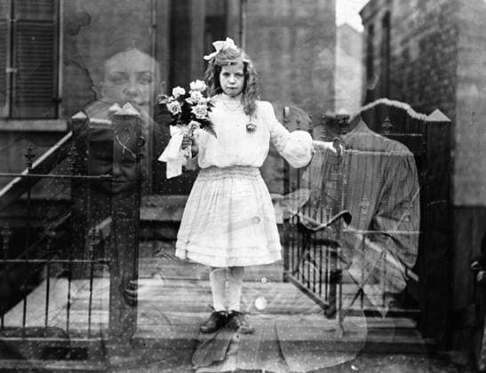 SPIRIT PHOTOGRAPH, c1905. Double exposure spirit photograph of a girl surrounded by spectral figures of women holding infants. Photograph by G.S. Smallwood, c1905.  Copyright: xGRANGERx xGRANGERx 0118604