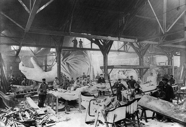 STATUE OF LIBERTY, c1882. Workmen constructing the Statue of Liberty in Bartholdi s Parisian warehouse workshop. This was the first model, here showing the left hand and a quarter-size head. Photograph, c1882.  Copyright: xGRANGERx xGRANGERx 0118612