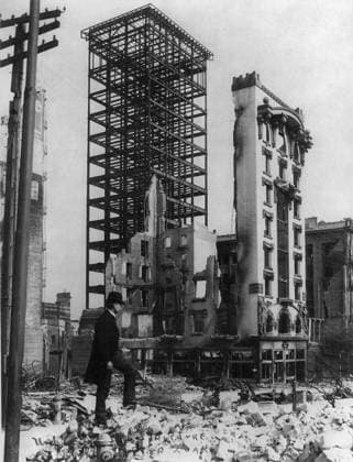 SAN FRANCISCO EARTHQUAKE. A man standing amid the rubble with an unfinished steel structure of a building and a facade of another still intact, following the earthquake of 18 April 1906. Stereograph, 1906.  Copyright: xGRANGERx xGRANGERx 0119565