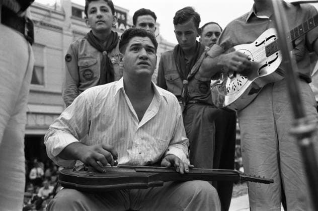 GUITAR PLAYER, 1938. Cajun Hawaiian guitar player at the National Rice Festival, Crowley, Louisiana. Photograph by Russell Lee, October 1938.  Copyright: xGRANGERx xGRANGERx 0121606