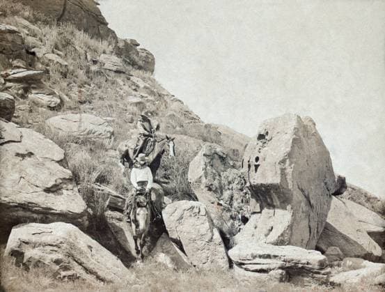 TEXAS: COWBOYS, c1908. Two cowboys on horseback traveling down a rocky hillside trail at the LS Ranch in Texas. Photograph by Erwin Evans Smith, c1908.  Copyright: xGRANGERx xGRANGERx 0124961