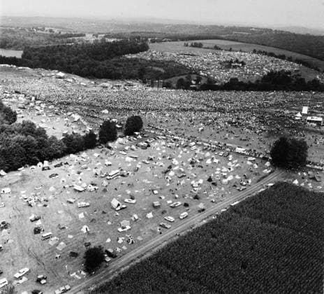 WOODSTOCK FESTIVAL, 1969. Aerial view of the Woodstock Music Festival at Bethel, Sullivan County, north of New York City, 16 August 1969. The bandstand can be seen at the upper center of the image. Photograph by Marty Lederhandler.  Copyright: xGRANGERx xGRANGERx 0129576