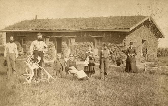 NEBRASKA: SETTLERS, c1886. Family of homesteaders, photographed outside of their sod house on Victoria Creek near Merna, Custer County, Nebraska. Photograph by Solomon D. Butcher, c1886.  Copyright: xGRANGERx xGRANGERx 0130679