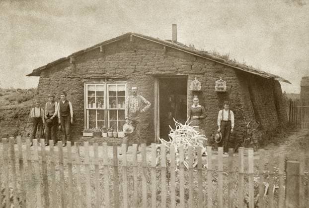 NEBRASKA: SETTLERS, c1886. Family of homesteaders standing in front of their sod house at Loup County, Nebraska. Photograph by Solomon D. Butcher, c1886.  Copyright: xGRANGERx xGRANGERx 0130681