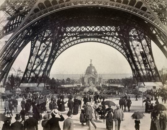 PARIS EXPOSITION, 1889. Crowds walking under the base of the Eiffel Tower while attending the Universal Expostion in Paris, 1889, looking toward the Central Dome.  Copyright: xGRANGERx xGRANGERx 0130897