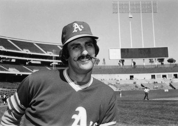 ROLLIE FINGERS (1946- ). Roland Glen Fingers, known as Rollie. American baseball pitcher. As a member of the Oakland Athletics, at Oakland-Alameda County Coliseum, Oakland, California. Photograph, 1975.  Copyright: xGRANGERx xGRANGERx 0169912
