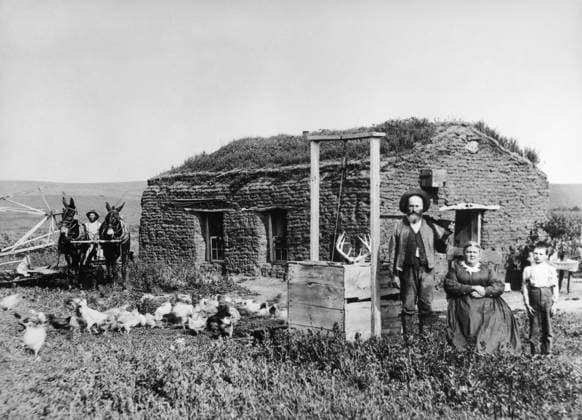 NEBRASKA: SETTLERS, 1888. Homesteader James McCrea and family in front of their sod house dugout near Berwyn, Custer County, Nebraska. Photograph by Solomon D. Butcher, 1888.  Copyright: xGRANGERx xGRANGERx 0176494