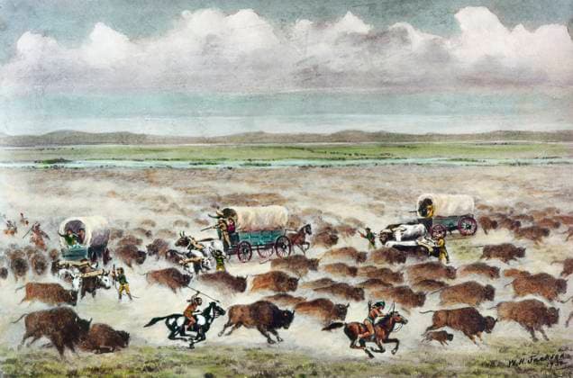OREGON TRAIL: STAMPEDE. Covered wagons carrying settlers to the west caught in a buffalo stampede, caused by Native American hunters, on the Oregon Trail in Nebraska, c1866. Watercolor by William Henry Jackson, 1932.  Copyright: xGRANGERx xGRANGERx 0183514
