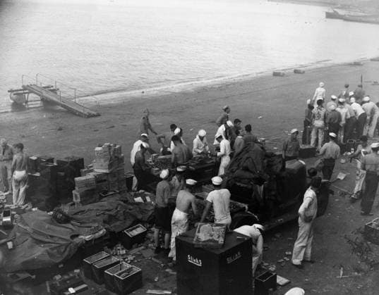 WWII: PEARL HARBOR, 1941. American sailors at Naval Air Station Ford Island reloading ammunition clips and belts during attacks on Pearl Harbor. Photograph. 7 December 1941.  Copyright: xGRANGERx xGRANGERx 0183729