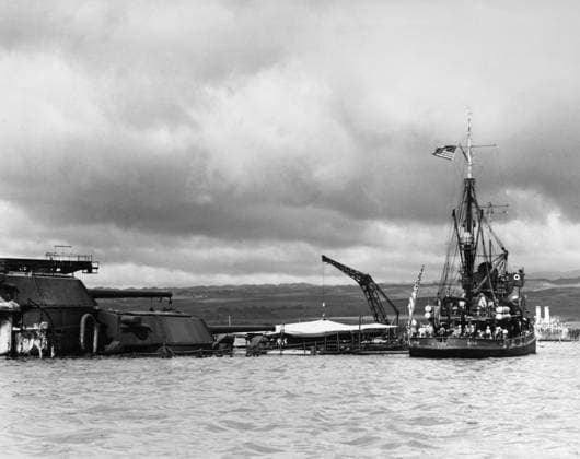 WWII: PEARL HARBOR, 1941. The USS Widgeon alongside the stern of the sunken USS Arizona, after the Japanese air attack on Pearl Harbor. Photograph, December 1941.  Copyright: xGRANGERx xGRANGERx 0183748