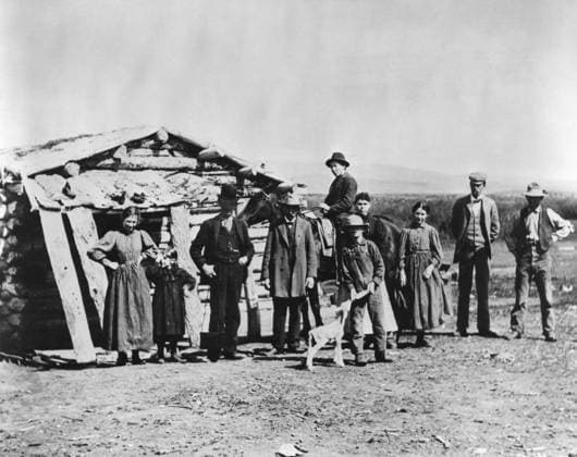 IDAHO: SETTLERS, c1882. A group of settlers standing outside a log cabin in American Falls, Idaho. Photographed c1882.  Copyright: xGRANGERx xGRANGERx 0184162