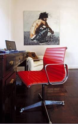 Red Eames chair at desk in modern home office Red Eames chair at desk in modern home office, Credit:Red Cover Home Journal Avalon 0538064334