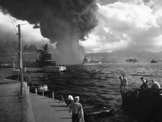 WWII: PEARL HARBOR, 1941. The USS California (left) damaged during the Japanese attack on the U.S. naval base at Pearl Harbor, Hawaii, 7 December 1941, with the USS Maryland and the capsized USS Oklahoma visible at right. Photograph, 1941.  Copyright: xGRANGERx xGRANGERx 0216228