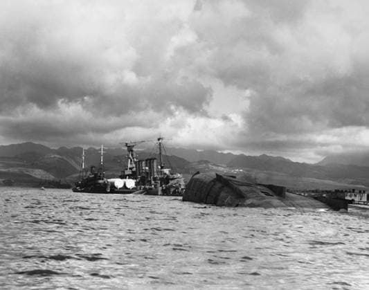 WWII: PEARL HARBOR, 1941. A view of the capsized USS Utah and the USS Raleigh, after the Japanese attack on Pearl Harbor. Photograph, December 1941.  Copyright: xGRANGERx xGRANGERx 0216513