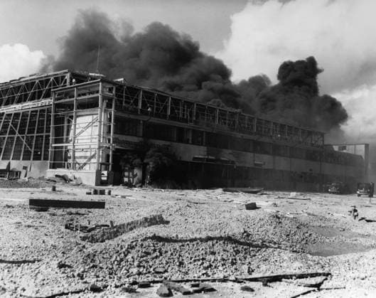WWII: PEARL HARBOR, 1941. A hangar burning at the Naval Air Station, Kaneohe Bay, Oahu, after the Japanese air attack. Photograph, 7 December 1941.  Copyright: xGRANGERx xGRANGERx 0216620