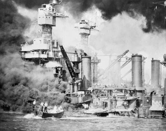 WWII: PEARL HARBOR, 1941. Sailors in a motor boat rescue a survivor from the water from the sinking USS West Virginia, after the Japanese air raid on Pearl Harbor. The USS Tennessee is also visible. Photograph 7 December 1941.  Copyright: xGRANGERx xGRANGERx 0216875