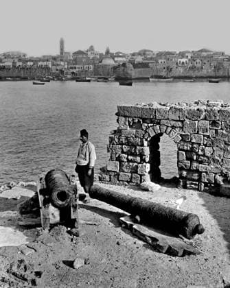 Palestine: A Palestinian man standing by an old canon at Acre, c. 1910 Palestine (Arabic: ÙÙ Ø³Ø·ÙäÙÜŽ Filasá¹­Ä«n, Falasá¹­Ä«n, Filisá¹­Ä«n; Greek: Î Î±Î»Î±Î¹ÏƒÏ Î¯Î½Î·, PalaistinÄ ; Latin: Palaestina; Hebrew: ×¤×œ× ×ª×™× × Palestina) is a name given to the geographic region between the Mediterranean Sea and the Jordan River. The region is also known as the Land of Israel (Hebrew: ××¨×¥Ö¾×™× ×¨××œ Eretz-Yisra el), the Holy Land and the Southern Levant.<br ><br > In 1832 Palestine was conquered by Muhammad Ali s Egypt, but in 1840 Britain intervened and returned control of the Levant to the Ottomans in return for further capitulations. The end of the 19th century saw the beginning of Zionist immigration and the Revival of the Hebrew Copyright: xxPicturesxFromxHistoryx