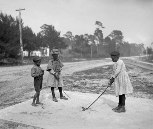 GOLFING, c1905. Children playing golf. Photograph, c1905.  Copyright: xGRANGERx xGRANGERx 0265119