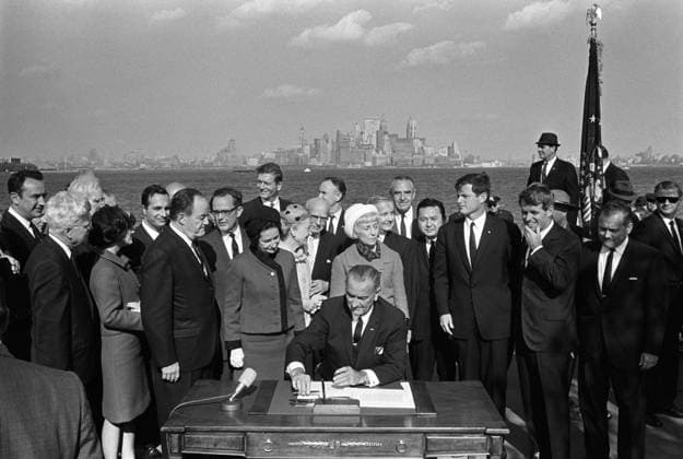 LYNDON BAINES JOHNSON (1908-1973). 36th President of the United States. Signing the Immigration Act on Liberty Island in New York City. Photograph by Yoichi Okamoto, 3 October 1965.  Copyright: xGRANGERx xGRANGERx 0370618