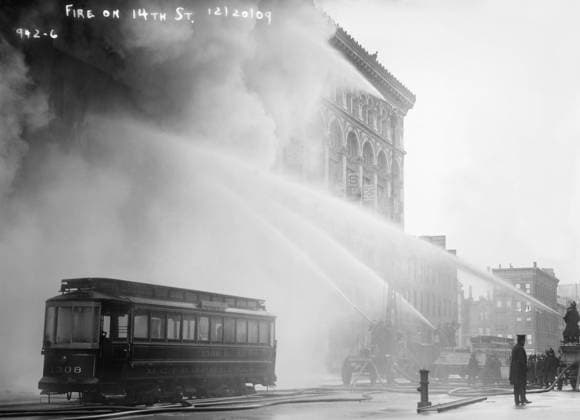 NYC: FIRE, 1909. Firemen spraying a burning building on 14th Street in New York City. Photograph, 20 December 1909.  Copyright: xGRANGERx xGRANGERx 0371058