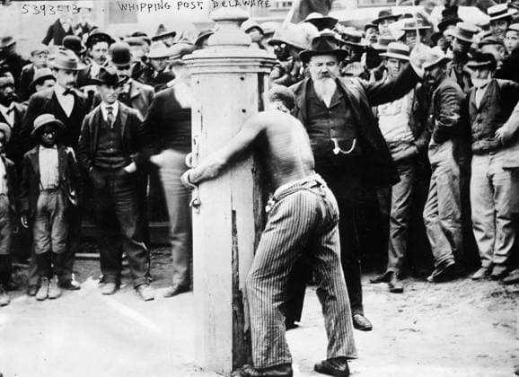 PUBLIC FLOGGING, 1910. A public flogging at a whipping post in Delaware. Photograph, c1910.  Copyright: xGRANGERx xGRANGERx 0433925