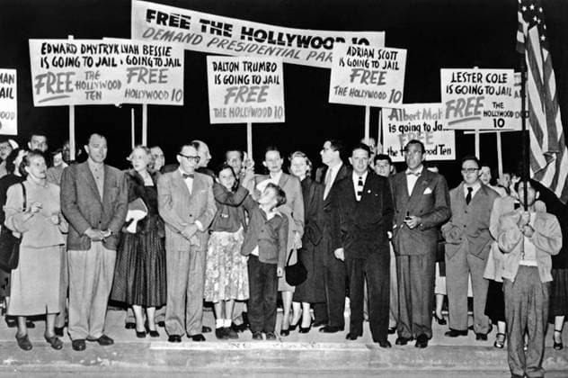 DALTON TRUMBO (1905-1976). American screenwriter. Trumbo (second man from left) surrounded by supporters, on his way to prison to serve a yearlong sentence for contempt of Congress for refusing to provide information regarding Communism in Hollywood. Photograph, 1950.  Copyright: xGRANGERx xGRANGERx 0526935