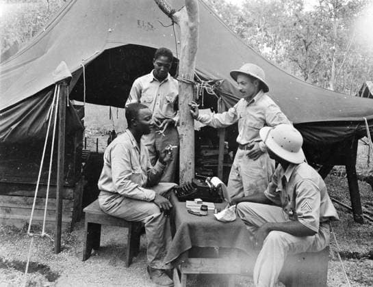 WWII: NEW GUINEA, 1943. U.S. Army Chaplain Theodore R. Frierson meeting with American troops in New Guinea during World War II. Photograph, 1943.  Copyright: xGRANGERx xGRANGERx 0527323