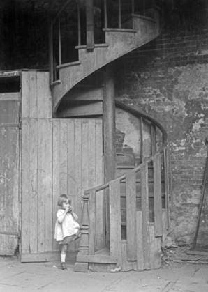 NEW ORLEANS, c1925. A spiral staircase in New Orleans, Louisiana. Photograph by Arnold Genthe, c1925.  Copyright: xGRANGERx xGRANGERx 0527354