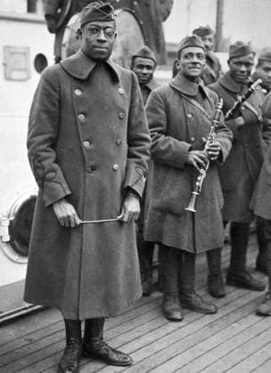 WWI: HOMECOMING, 1919. Lieutenant James Reese Europe with the regimental band of the 369th Infantry Regiment returning home aboard the SS Stockholm. Photograph, February 1919.  Copyright: xGRANGERx xGRANGERx 0528290