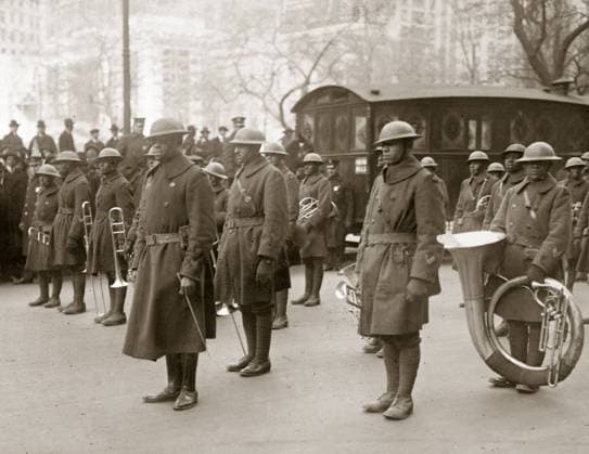 WWI: BAND, 1919. Lieutenant James Reese Europe with the regimental band of the 369th Infantry Regiment, at a homecoming parade in New York City. Photograph, February 1919.  Copyright: xGRANGERx xGRANGERx 0528298