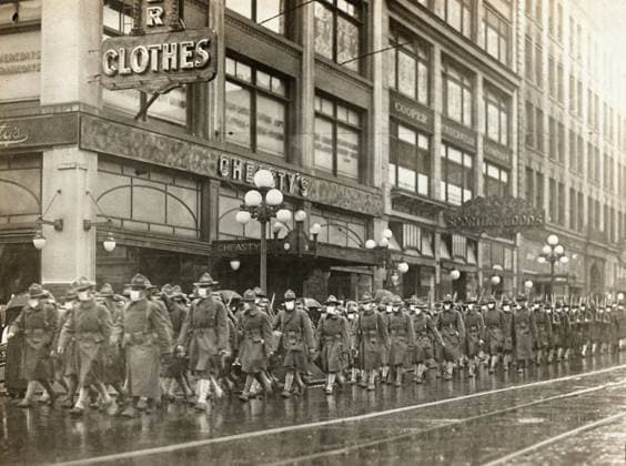 FLU PANDEMIC, 1918. The 39th Regiment, wearing face masks provided by the Red Cross, marching in Seattle, Washington, prior to their departure for France. Photograph, December 1918.  Copyright: xGRANGERx xGRANGERx 0529217