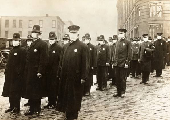 FLU PANDEMIC, 1918. Policemen in Seattle, Washington, wearing face masks provided by the Red Cross. Photograph, December 1918.  Copyright: xGRANGERx xGRANGERx 0529237