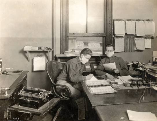 FLU PANDEMIC, 1918. Troops at work in the hospital offices at Fort Porter in Buffalo, New York, during the influenza pandemic. Photograph, 1918.  Copyright: xGRANGERx xGRANGERx 0529247