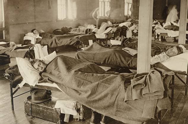 FLU PANDEMIC, 1918. Influenza patients in the barracks hospital at Colorado Agricultural College in Fort Collins, Colorado, during the influenza pandemic. Photograph, 1918.  Copyright: xGRANGERx xGRANGERx 0529257