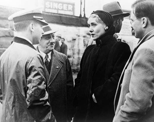 CLARE BOOTHE LUCE (1903-1987). American socialite, playwright, and congresswoman. Luce, as the American ambassador to Italy, wearing a black mink coat at the American Day at the 33rd Fiera di Milano exhibition. Photograph, April 1955.  Copyright: xGRANGERx xGRANGERx 0621618