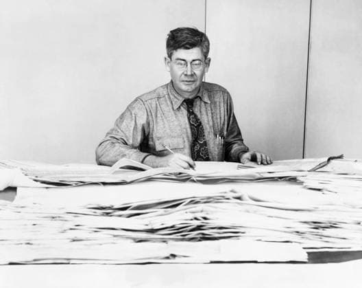 MAURICE EWING (1906-1974). American geophysicist and oceanographer. Seated at a table covered with seismograms. Photograph by Manny Warman, 1951.  Copyright: xGRANGERx xGRANGERx 0622548