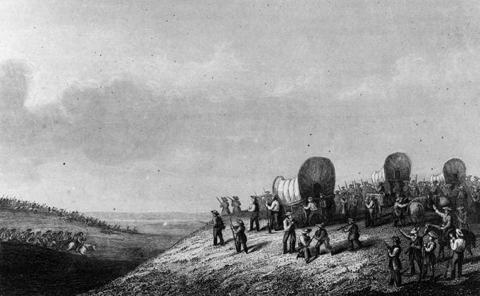 CIMARRON RIVER RAID, c1850. A pioneer wagon train near the Cimarron River is confronted by a group of mounted Native American. Engraving, c1850.  Copyright: xGRANGERx xGRANGERx 0622927
