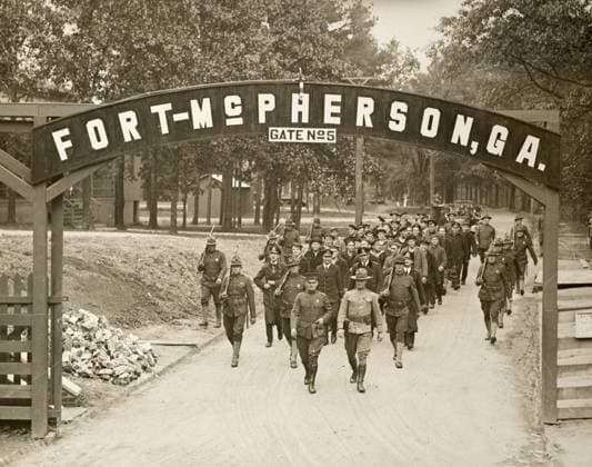 WWI: GERMAN PRISONERS, 1918. Prisoners of war captured from the German submarine U-58 at Fort McPherson, Georgia, guarded by U.S. Marines. Photograph by Mathewson & Winn, April 1918.  Copyright: xGRANGERx xGRANGERx 0623028