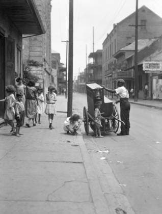 NEW ORLEANS: ORGAN GRINDER. An organ grinder on a street in New Orleans, Louisiana. Photograph by Arnold Genthe, c1923.  Copyright: xGRANGERx xGRANGERx 0634230