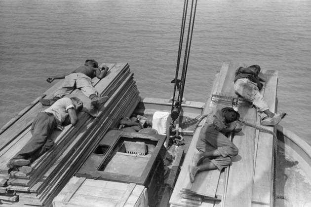 NEW ORLEANS: STEVEDORES. African American stevedores sleeping on a pile of lumber on a boat along the Mississippi River near New Orleans, Louisiana. Photograph by Russell Lee, September 1938.  Copyright: xGRANGERx xGRANGERx 0636818