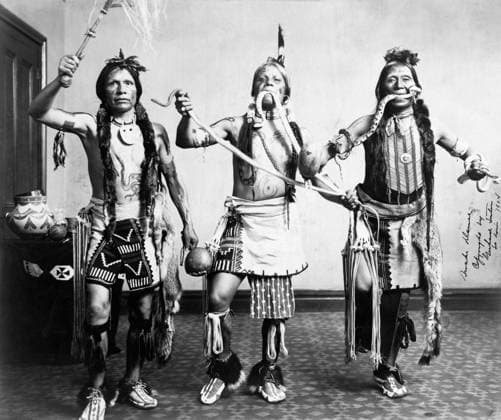 NATIVE AMERICAN DANCERS. Three Native American men posed in a dance. Photographed by Emme and Mayme Gerhard at the Louisiana Purchase Exposition in St. Louis, Missouri, 1904.  Copyright: xGRANGERx xGRANGERx 0640751