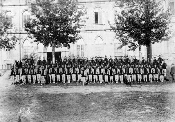 CHINA: BOXER REBELLION, 1900. Uniformed students posing outside of the Imperial University of Tianjin during the Boxer Rebellion. Photograph, 1900.  Copyright: xGRANGERx xGRANGERx 0640854